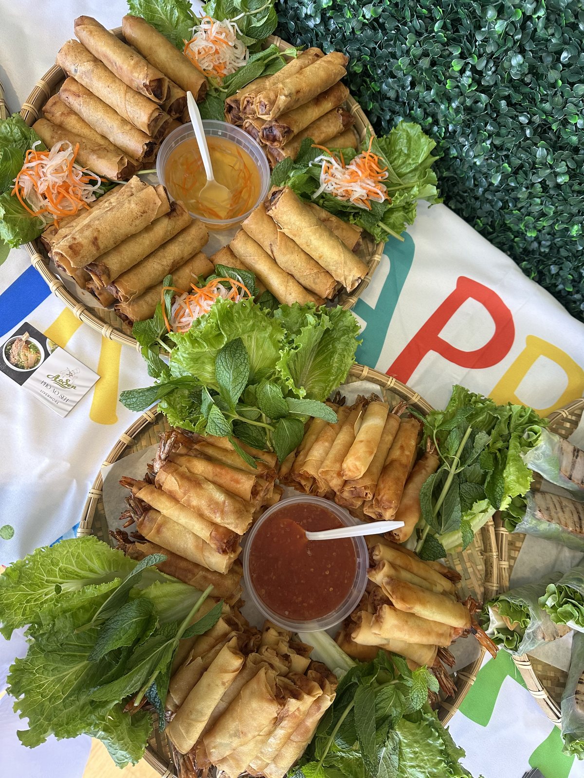 Egg rolls and shrimp rolls at a catering event