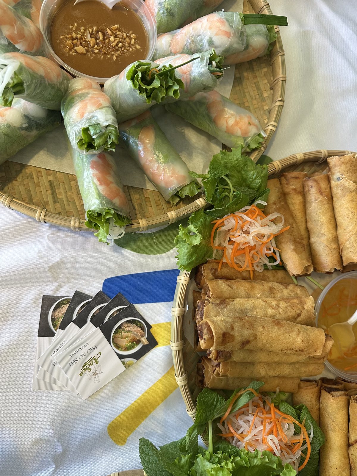 Fresh spring rolls and egg rolls on catering trays